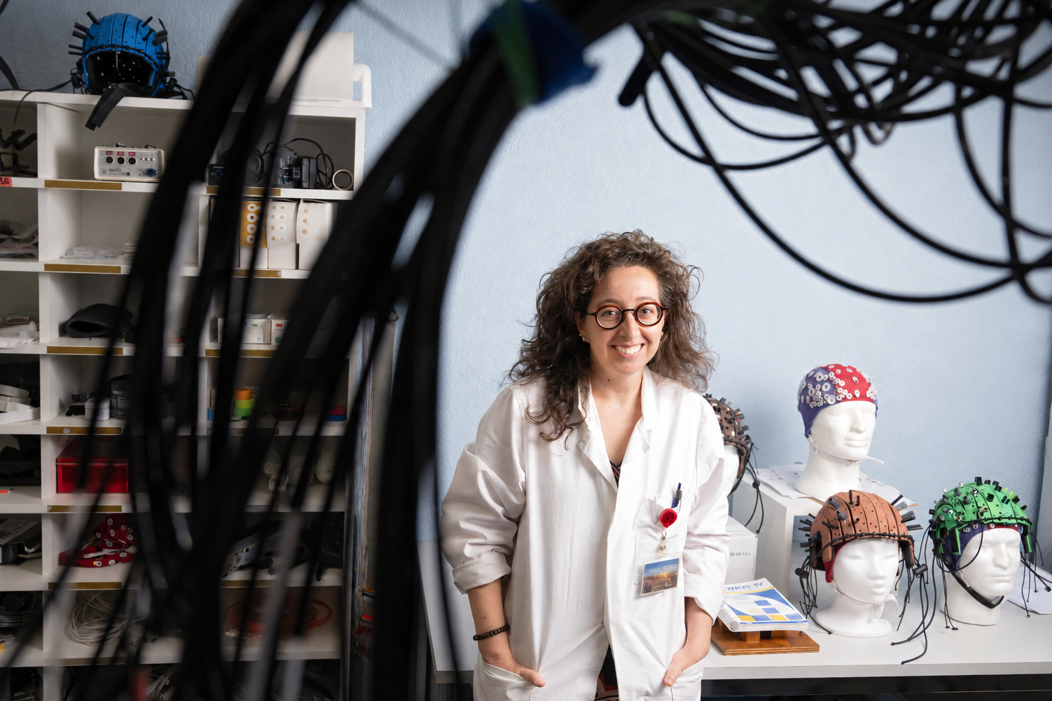Alessandra Lintas in the NHRG laboratory beside neurophysiology recording equipment